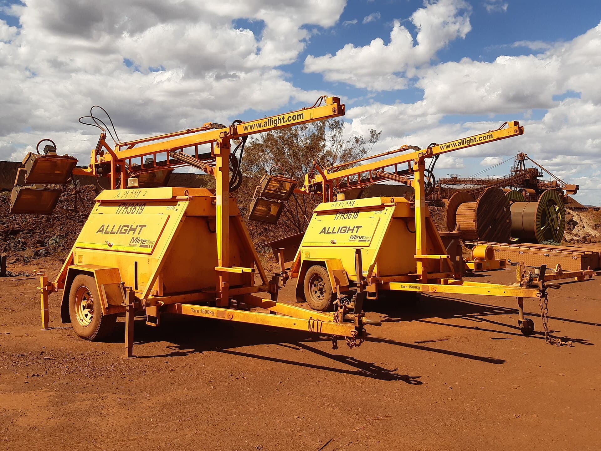 Mobile lighting towers staged beside a reclaimer at the Brockman 4 mine in the Pilbara, Western Australia.